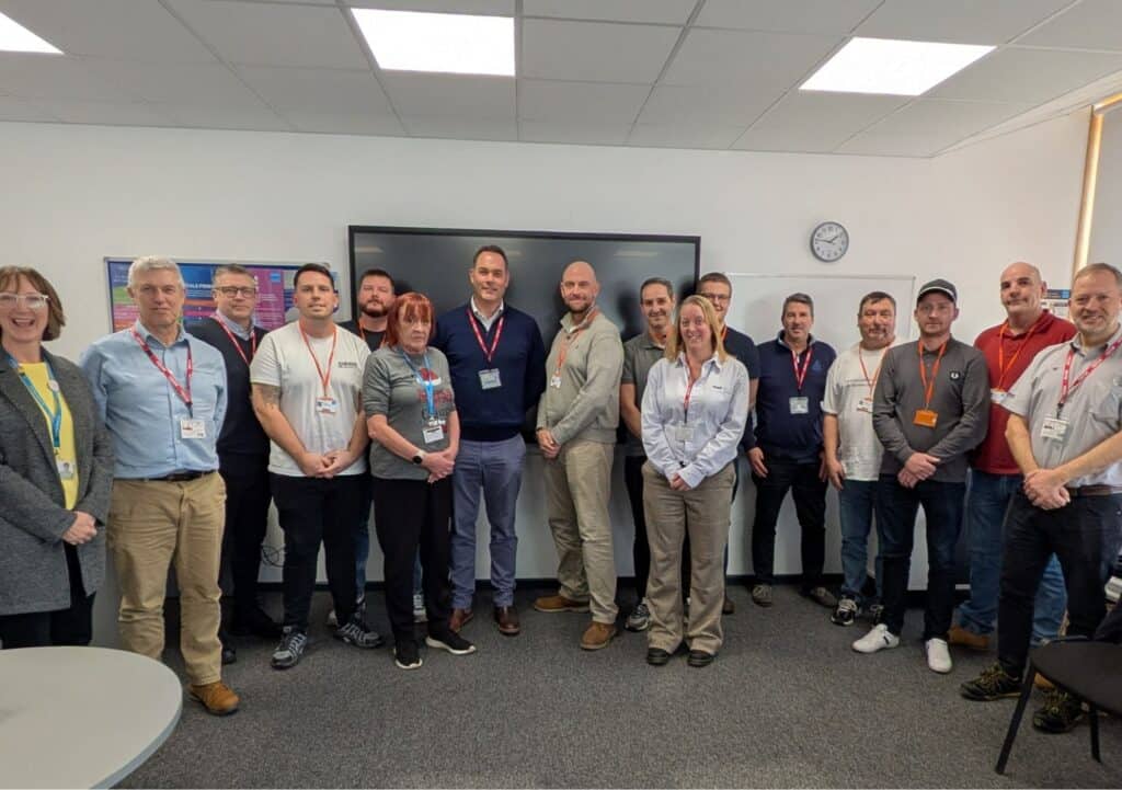 Princess Yachts graduates pose in a classroom with CEO Will Green at City College Plymouth