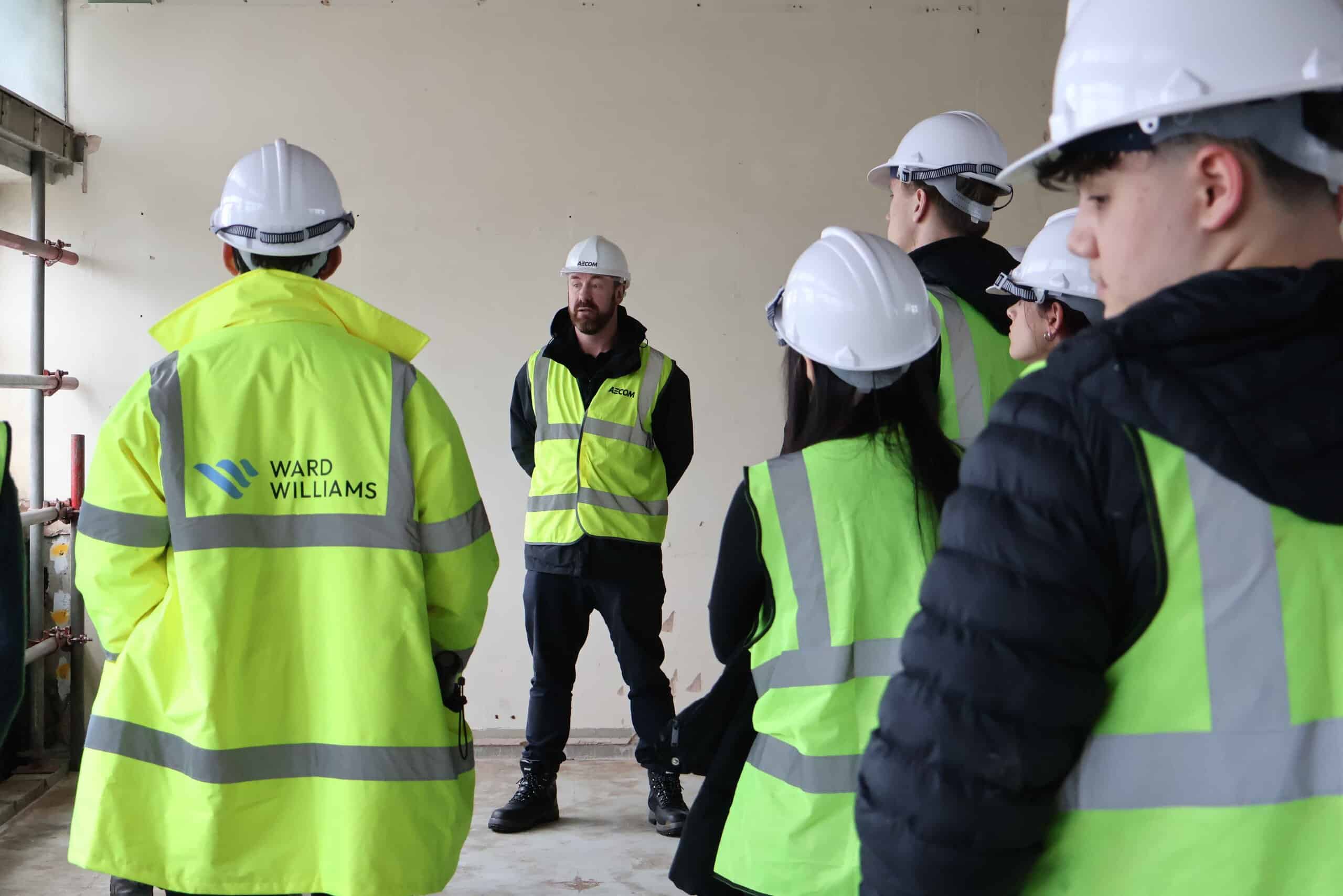 Project team briefing students inside Plymouth Civic Centre during current survey work